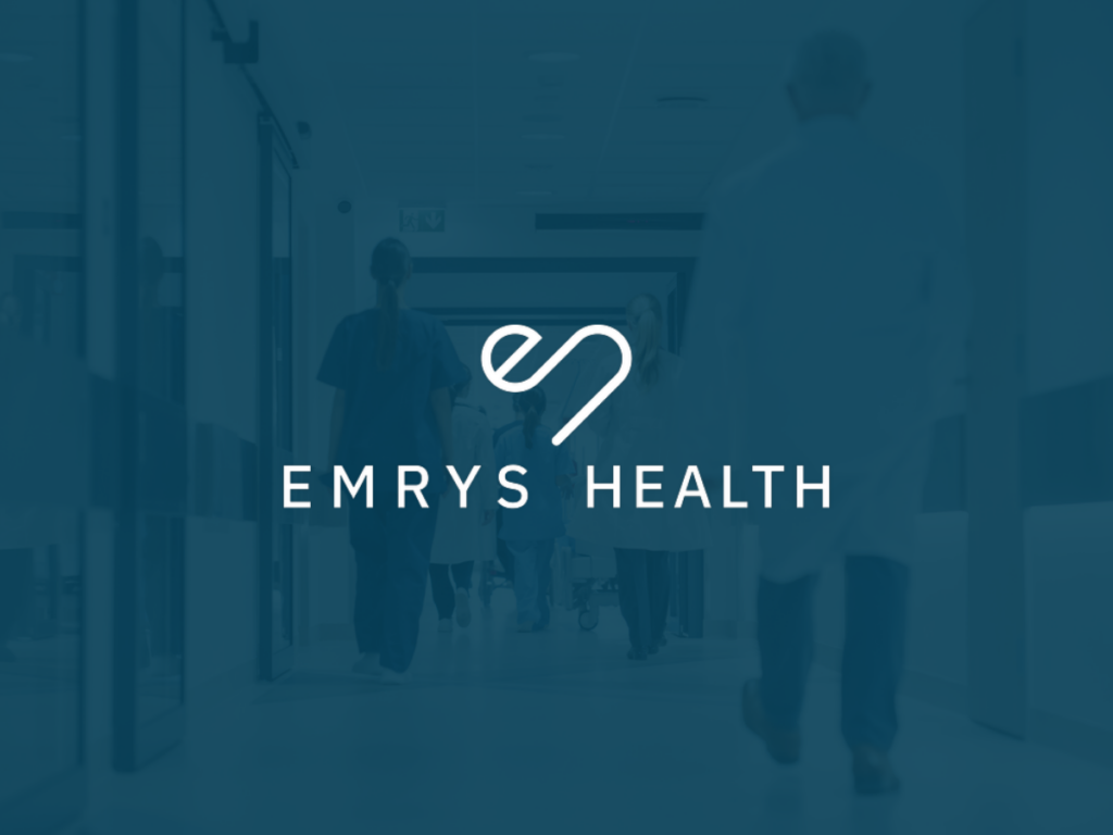 Emrys health blue image with white Emrys Health logo in the middle healthcare setting in the background.